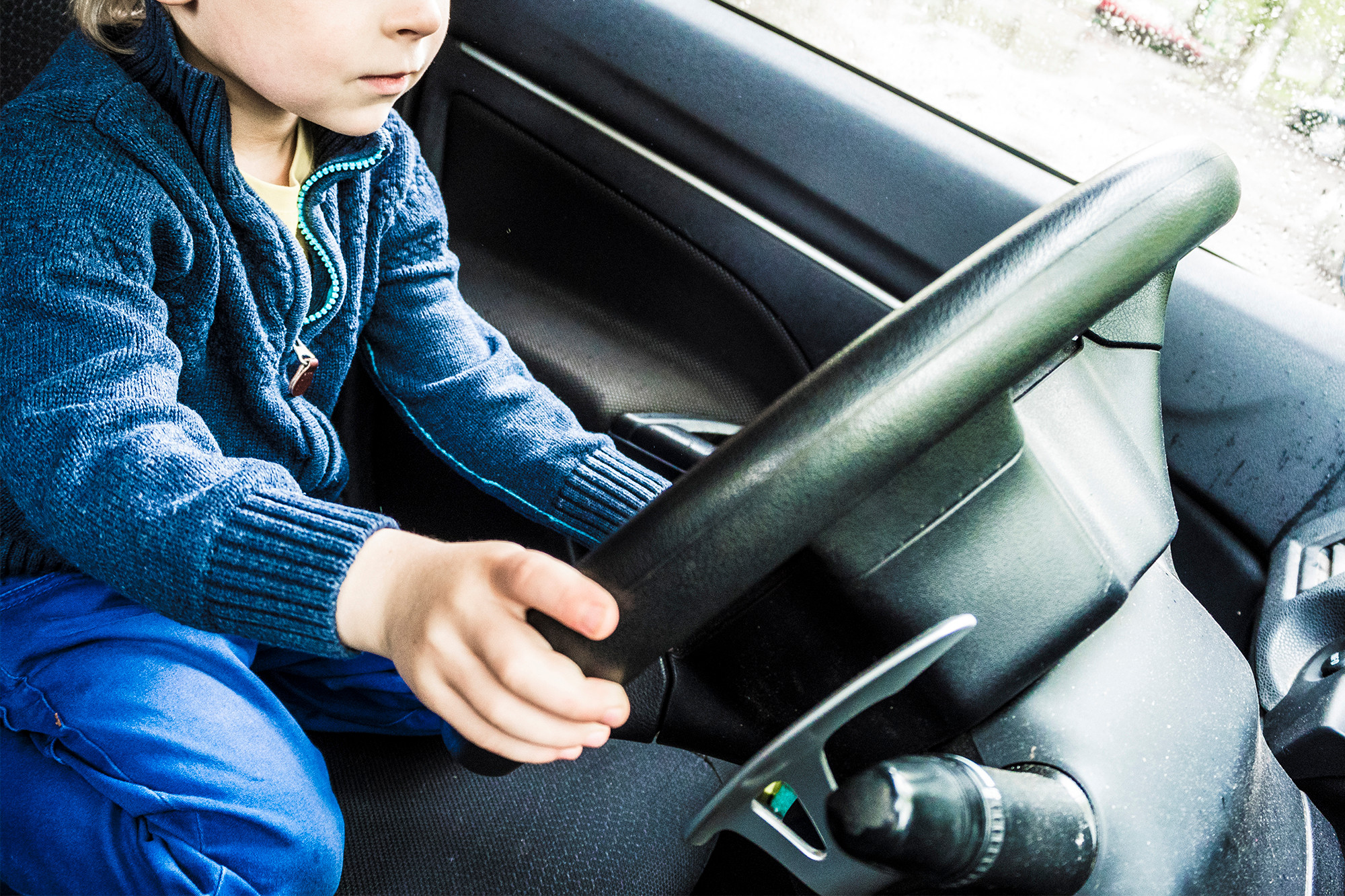 171109-boy-driving-car-feature