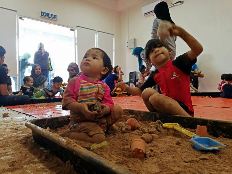 children playing in a sandbox