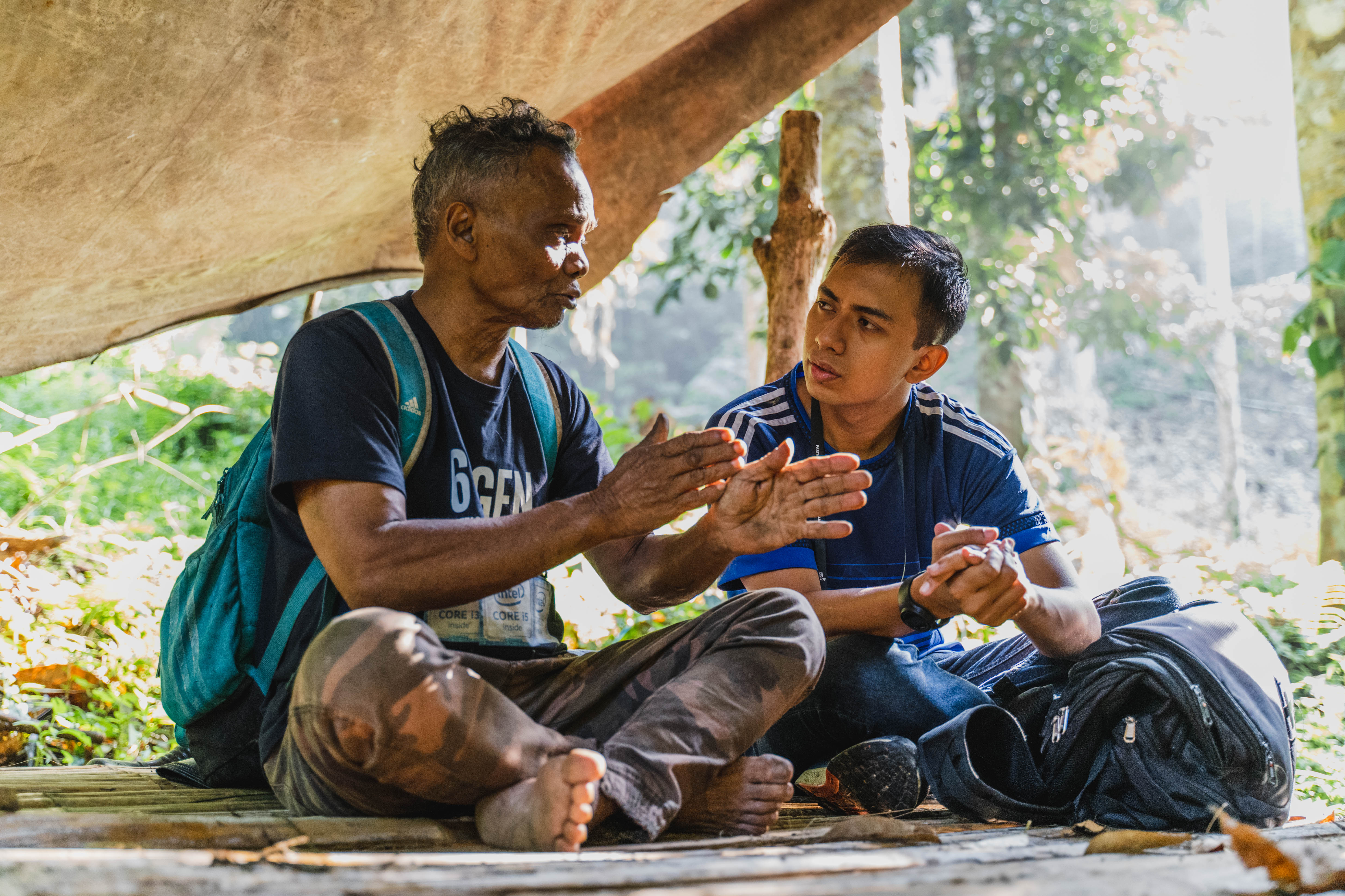 Guests engaging with Orang Asli Chief, Batin Ulang