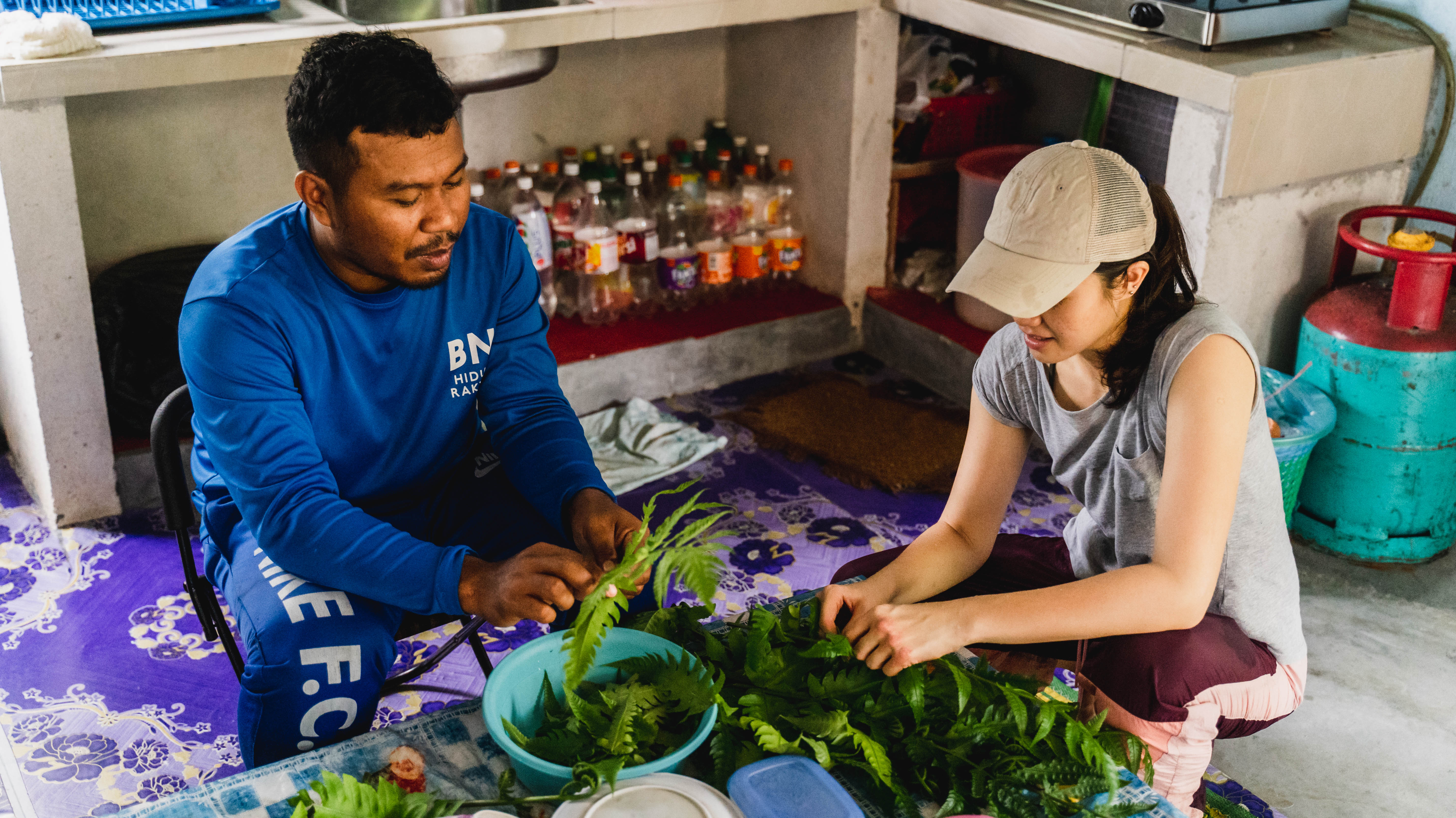 Guests preparing a meal with Faizul