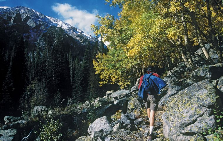 Man hiking up a mountain