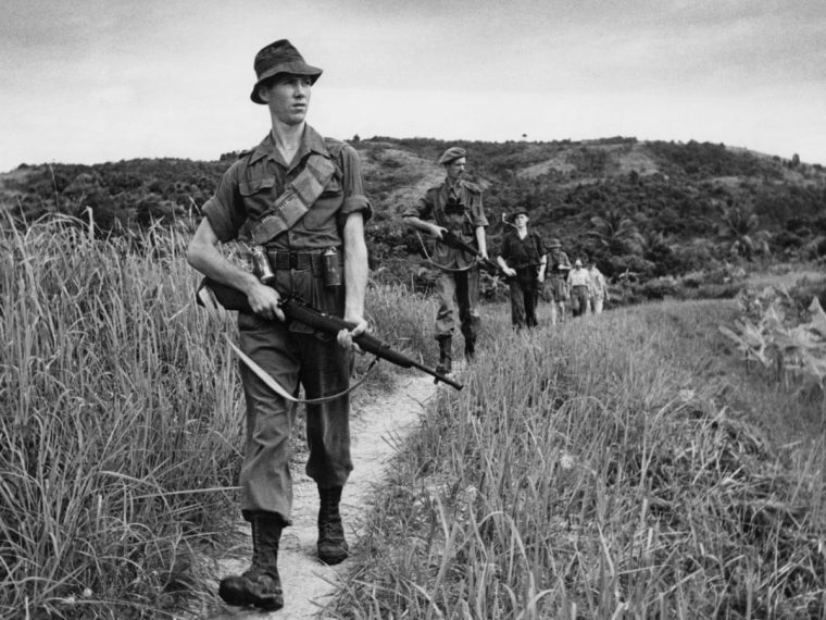 British soldiers patrolling the Malaya countryside