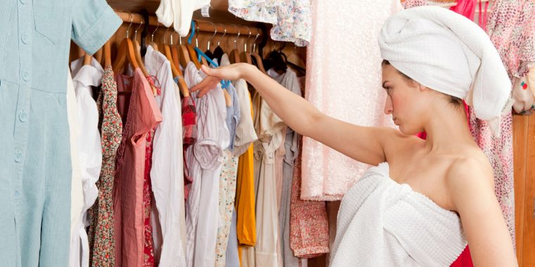 woman trying to choose the right outfit to stay cool