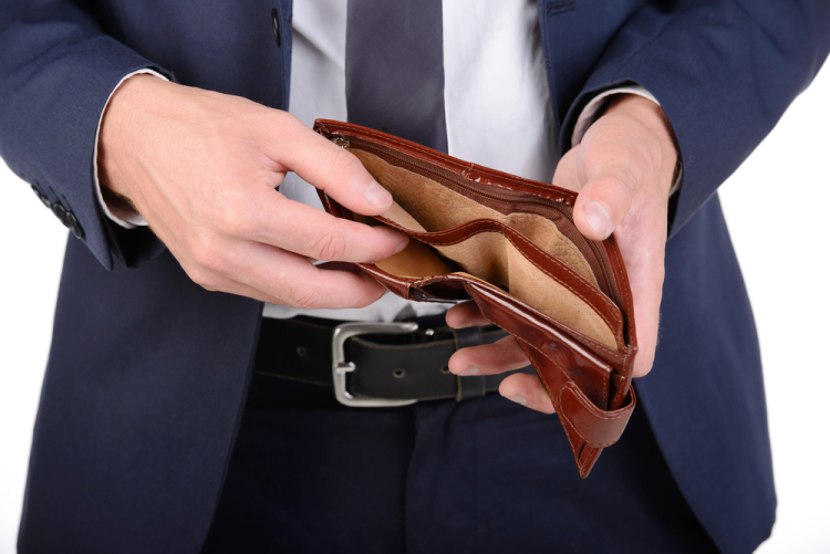 Man holding an empty wallet