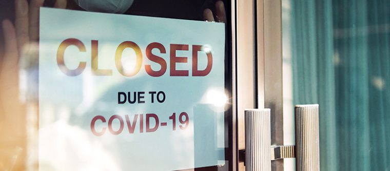 A restaurant sign that says "Closed Due To COVID-19"