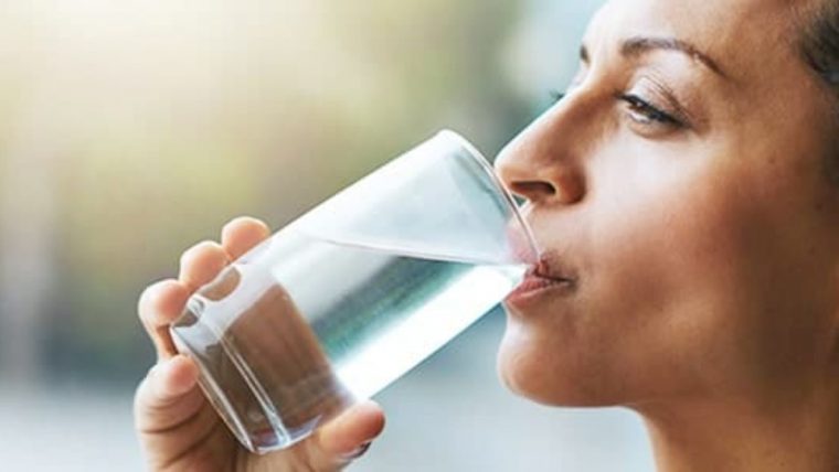 Woman drinking a glass of water