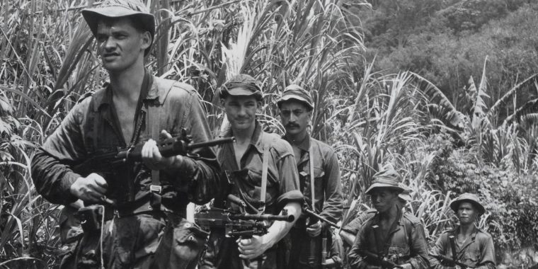 soldiers fighting against communist insurgents in the jungles of Malaysia