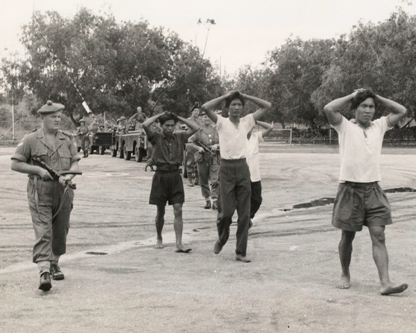 soldiers escorting surrendered prisoners during the Brunei revolt