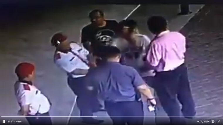 blurry screenshot of video where a Datin slaps a security guard