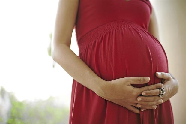 pregnant woman in red dress