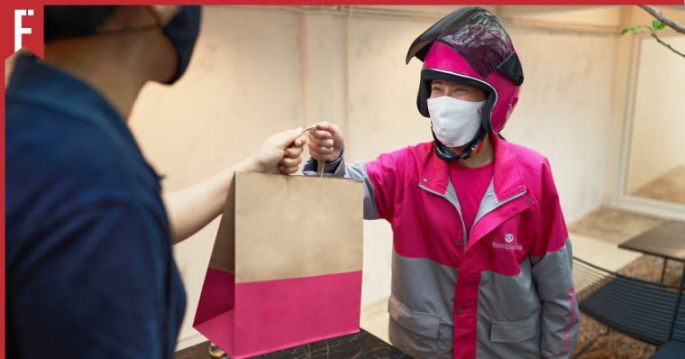 rider giving food to customer