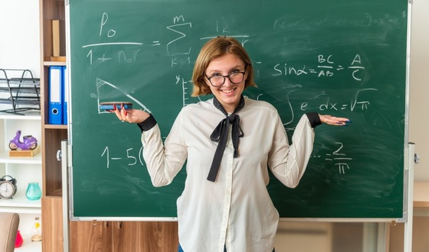 teacher in front of a blackboard