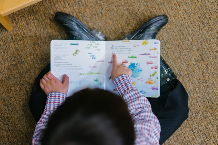 kid reading book